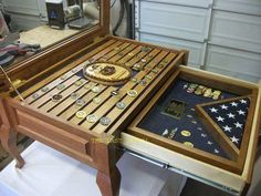 a wooden table topped with lots of different types of buttons