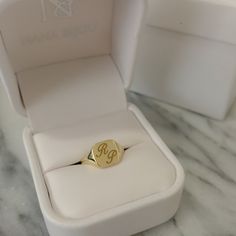 "This square shaped traditional signet style ring is composed of 14K solid gold & can be made finished with a raised cameo style engraving or a traditional style engraving of any initial letter or words in any font style you wish to have. NOTE: Please indicate the specific font style desired in the 'Note to Seller' section upon checkout. We will also gladly send a mock-up rendering of the engraving prior to purchasing the item by kindly sending us a \"Custom Order Request\" for the assurance Classic Rectangular Signet Ring With Initials, Rectangular Signet Ring With Engraving Option For Gift, Rectangular Signet Ring With Engraving Option, Heirloom Rectangular Signet Ring Stamped 14k, Personalized Rectangular Initial Ring Gift, Anniversary Initial Ring With Rectangular Shape, Classic Engraved Rectangular Initial Ring, Gold Rectangular Signet Ring Stamped 14k, Classic Rectangular Initial Ring For Wedding