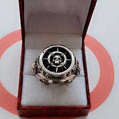 Product Description: Introducing our Pirate Skull Ring - a striking piece of jewelry that combines vintage charm with a punk twist. Handmade with precision and attention to detail, this signet ring embodies the spirit of the high seas and showcases a skull design that will captivate onlookers. Crafted from high-quality stainless steel, this ring is built to withstand the test of time and will become a treasured addition to any collection. Highlights: - Handmade item: Each ring is meticulously cr Silver Punk Jewelry With Metal Ring, Punk Skull Ring In Sterling Silver, Punk Style Silver Jewelry With Metal Ring, Punk Style Silver Promise Ring Jewelry, Punk Sterling Silver Skull Ring Gift, Punk Style Sterling Silver Skull Ring Gift, Punk Style Sterling Silver Ring As Gift, Silver Sterling Punk Rings, Punk Silver Engraved Jewelry