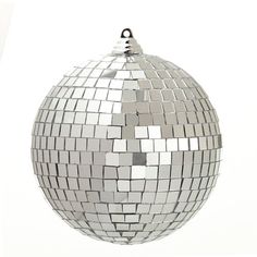 a silver disco ball ornament hanging from a chain on a white background with reflections