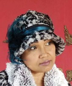 Grace Cloche Style Hat - Luxury Faux Fur Savannah Cat in Gray - Pandemonium Millinery #pandemonium #pandemoniumhats #pandemoniummillinery #Seattle #WA #handmade #madeinUSA #vintage #classic #millinery #hat #hats #passion4hats #gray #green #teal #peacock #blue #black #animalprint #cat #feather #ostrich #ostrichfeather #bespoke #custom #cloche Winter Fedora With Feather Trim, Winter Fedora Hat With Feather Trim, Adjustable Winter Hat With Feather Trim, Fitted Flapper Cloche Hat With Brim, Winter Gatsby Style Fitted Cloche Hat, Winter Gatsby Fitted Hat, Fitted Brimmed Winter Bucket Hat, Winter Adjustable Cloche Top Hat, Fitted Brimmed Bucket Hat For Winter