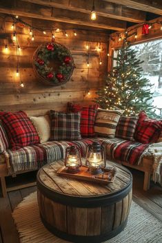 a living room decorated for christmas with plaid furniture and lights on the walls, along with a tree