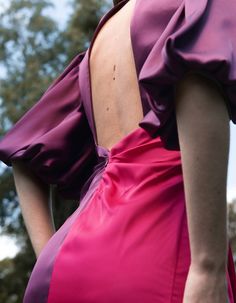 Product description : Junon two-tone satin dress in purple and fuchsiaMaxi dress with puffy sleeves, flattering asymmetrical draping and a beautiful open back. Decorative golden buttons at front, closure at back. Our model is 5'11" (1m80) and wears a size 36 (French size) Fabric: 100% PL , from SpainMade in FranceCare Instructions : Dry clean onlyABOUT THE BRAND : DIANE Paris creates joyful clothing for special occasions and to make you everyday happy. A colourful wardrobe made with love in our Junon Dress, Colourful Wardrobe, Everyday Happy, Colorful Wardrobe, Dress With Puffy Sleeves, Puffy Sleeves, Draped Fabric, Satin Dress, Purple Dress