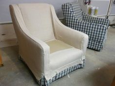 two chairs are sitting next to each other in a room with plaid upholstered furniture