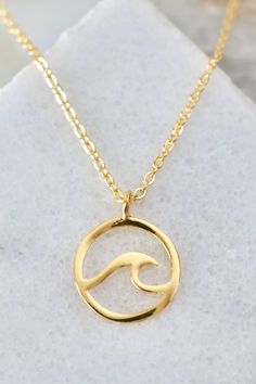 Wave Necklace from Southern Sunday Gold Ocean-inspired Pendant Jewelry, Ocean-inspired Gold Pendant Jewelry, Minimalist Gold Necklaces For The Beach, Gold Minimalist Necklace For Beach, Minimalist Gold Necklace For Beach, Ocean-inspired 14k Gold Jewelry, Gold Round Pendant Necklace For Beach, Tarnish Resistant Gold Beach Jewelry, Tarnish Resistant Gold Jewelry For Beach