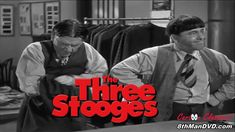 two men standing next to each other in front of a rack of shirts with the words three stooges on it