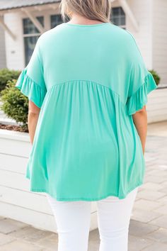 This top is too sweet! It has a flirty and feminine design with a figure-flattering fit you'll want to wear all day long! It's light and flowy and has the cutest ruffled sleeves! Not to mention how easy the solid mint color is to pair with your favorite accessories! Style this top with skinnies and wedges for an effortlessly chic look! 95% Rayon, 5% Spandex Made In USA. Spring Vacation Ruffle Sleeve Tops, Vacation Flutter Sleeve Top With Ruffle Hem, Spring Vacation Tops With Ruffle Sleeves, Vacation Tops With Ruffle Hem And Flutter Sleeves, Flutter Sleeve Tops With Ruffle Hem For Vacation, Trendy Flowy Top With Ruffle Sleeves, Trendy Flowy Tops With Ruffle Sleeves, Green Ruffle Hem Top For Spring, Trendy Flutter Sleeve Tops For Brunch