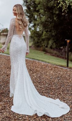 Here is a beautiful sequin and crystal beaded long sleeve backless wedding gown with open bust line that is available as shown or with any changes. #Brides can also email us their dream #weddingdress #photos and we can easily recreate that #design as well. For more info on #custom #weddingdresses please contact us directly. Backless Wedding Gown, Wedding Gown Backless, Open Bust, Long Sleeve Wedding Dress Lace, Backless Wedding, Wedding Dress Long Sleeve, Wedding Gown, Crystal Beads, Wedding Gowns