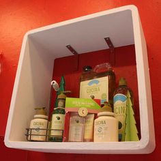 the shelf is filled with different types of skin care products