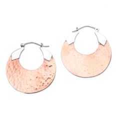 This stunning pair of hoop earrings designed by artisan Nyoman Nartawan of Bali feature hammered moons of 18k rose gold plated copper. The saddleback clasps connect to the copper hoops with pennants of sterling silver. Artisan Hammered Rose Gold Jewelry, Copper Hammered Hoop Earrings As Gift, Hammered Rose Gold Copper Jewelry, Artisan Rose Gold Hammered Jewelry, Hammered Copper Hoop Earrings As Gift, Hammered Rose Gold Hoop Earrings Gift, Rose Gold Hammered Metal Earrings, Artisan Hammered Hoop Jewelry, Hammered Rose Gold Copper Earrings