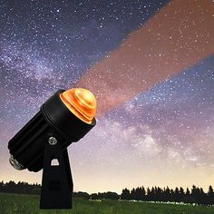 an image of a telescope that is in the sky with stars and trees behind it