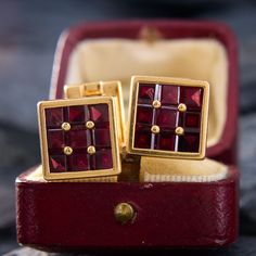 These fantastic square-faced cufflinks hold channel and prong set rhodolite garnets. The garnets have incredibly rich and deep color. They are crafted in 14k yellow gold and stamped Tiffany & Co. Elegant Red Cufflinks For Formal Occasions, Classic Red Cufflinks For Formal Occasions, Timeless Square Jewelry For Formal Occasions, Luxury Rectangular Jewelry For Business, Elegant Rectangular Cufflinks With Polished Finish, Square Jewelry With Polished Finish For Formal Occasions, Formal Yellow Gold Garnet Jewelry, Timeless Red Jewelry For Formal Occasions, Luxury Polished Garnet Jewelry