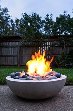 an outdoor fire pit with rocks in it