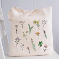 "Wildflower Tote Bag Floral Tote Bag Canvas Aesthetic Floral Print Tote Bag Flower Tote Farmers Market Eco Friendly Sustainable Bag  100% heavy cotton canvas. Product Size: 15\"W x 16\"H Machine washable, Eco-friendly, durable, recyclable Totes are perfect for carrying books, clothing, tradeshow goodies and more Bulk Discounts available. RETURNS/EXCHANGES: We do not accept returns as these are made to order just for you, BUT If for any reason you are not completely satisfied with your order, just send us a message and we'll sort out the issue as soon as possible. You can also purchase this design printed on a crewneck sweatshirt here: https://www.etsy.com/ca/listing/951161802/tpwk-treat-people-with-kindness-vsco?ref=shop_home_recs_18&pro=1&frs=1 Thank you for stopping by my shop! if you ha White Large Capacity Flower-shaped Shoulder Bag, White Flower-shaped Large Capacity Shoulder Bag, Large Capacity Flower Shaped Shoulder Bag For Daily Use, White Flower Shaped Shoulder Bag With Large Capacity, Daily Use Flower-shaped Bag With Removable Pouch, Daily Use Flower-shaped Bags With Removable Pouch, White Flower Shoulder Bag For Everyday Use, White Flower-shaped Shoulder Bag For Everyday Use, Green Floral Print Tote Bag