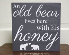 an old bear lives here with his honey sign