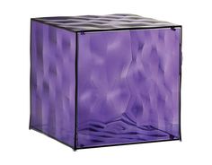 a purple glass cube with wavy lines on it