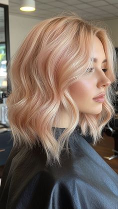 Peachy blonde is a delightful blend of soft blonde and warm peach tones, creating a fresh and playful look. This unique shade adds a touch of warmth and brightness to any style. Click the pin and follow us for more vibrant blonde ideas! #PeachyBlonde #HairColorInspo #BlondeGoals #VibrantHair #BlondeVibes Ion Strawberry Milk Toner, Blonde With Peach Highlights, Color Blocking Blonde Hair, Blonde Hair With Pink Undertones, Strawberry Blonde Pink Highlights, Strawberry Blonde With Platinum, Light Rose Gold Hair Blonde, Cool Strawberry Blonde Hair, Dream Hair Blonde