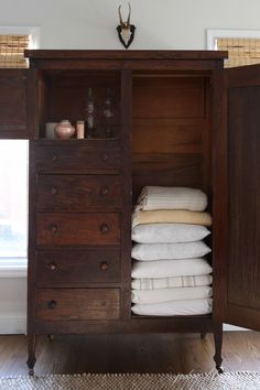 a dresser with folded towels in it and several pictures of the drawer open to show what's inside