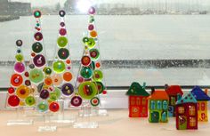 there are many colorful ornaments on the window sill in front of the windowsill