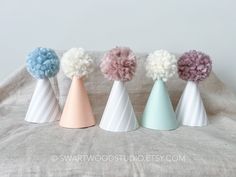 "POM PARTY HATS! Whatever your party theme, we have a hat color that will fit right in.  These neutral colored and striped hats are made of premium colored cardstock. Colored Cardstock has texture to it's surface giving it a very subtle linen look. Striped cardstock is smooth. Fluffy poms that top the hats are handmade. Size small hat measures: 2.5\" across and 3.5\" tall I recommend size small hats for 1 year olds but they also fit great on adults and pets.  Hats look good on babies, adults eve Hat Customization, Small Hats, Neutral Rainbow, Large Hats, Premium Colors, Bobby Pin, Birthday Hat, Pom Pom Hat, Party Hat