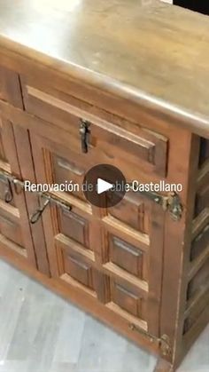 an old wooden cabinet with metal top and drawers on the bottom is shown in this video