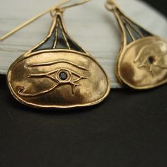 Hand carved ancient Egypt eye of Horus earrings.The Eye of Horus is an ancient Egyptian symbol of protection, royal power, and good health. The Eye of Horus is similar to the Eye of Ra, which belongs to a different god, Ra, but represents many of the same concepts.The eye of Horus was often used to symbolise sacrifice, healing, restoration, and protection.Funerary amulets were often made in the shape of the Eye of Horus. The symbol "was intended to protect the pharaoh in the afterlife" and to wa The Eye Of Ra, Egypt Eye, Egyptian Earrings, Ancient Egyptian Jewelry, Ancient Egyptian Symbols, Sapphire Eyes, Eye Of Ra, Egyptian Symbols, Egyptian Jewelry