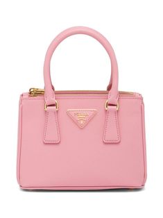 micro Galleria tote bag from PRADA featuring light pink, Saffiano leather, triangle logo, gold-tone hardware, top zip fastening, two rounded top handles, detachable shoulder strap and internal zip pocket. | Prada micro Galleria tote bag Pink Prada Bag, Goth Wardrobe, Leather Mini Bag, Luxury Bags Collection, Girly Bags, Cute Handbags, Luxury Purses, Fancy Bags