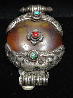 Traditional Amber Jewelry With Carved Details, Traditional Amber Round Beads And Cabochons, Traditional Brown Engraved Jewelry, Traditional Silver Round Beads, Gems, And Cabochons, Traditional Silver Pendant Beads, Middle Eastern Jewelry, Amber Pendant, Overland Park, Coral Turquoise