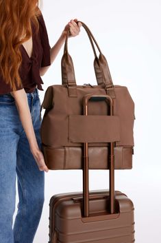 Introducing the mini to our OG weekender. This bag is the minimalists dream and is perfect for your personal item, an overnight trip, or even a weekend away. Take the stress out of packing with a wide easy access opening so you can see everything inside, a built-in padded laptop sleeve, and a separate bottom compartment (perfect for shoes). Ready to go? Simply slide our trolley passthrough pocket over your suitcase handles and you’re off! Perfect For: The ideal personal item, shaped to fit your The Minimalists, Bottle Sling, Mini Convertible, Suitcase Handle, Yellow Gifts, Weekender Bags, Work Accessories, Luggage Covers, Accessories Packing