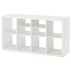 a white shelf unit with six compartments