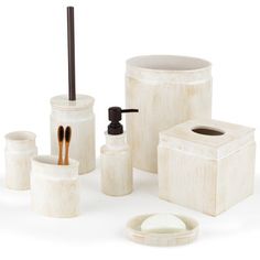 bathroom accessories including soap dispenser, toothbrush holder and toilet paper roll