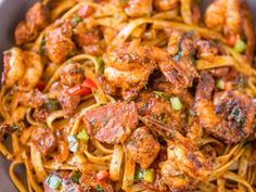 pasta with shrimp and tomato sauce in a bowl