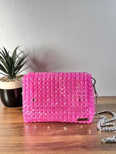 Dazzling nights call for an exquisite companion. This beaded evening bag adds the perfect touch of glamour to your ensemble. Dimension: Width: 18cm Height: 13cm Depth: 6cm The bag comes with two detachable handles. Feel free to contact me for any questions. Beaded Pink Evening Bag For Events, Pink Beaded Formal Bags, Cheap Pink Beaded Shoulder Bag, Pink Beaded Rectangular Evening Bag, Pink Beaded Shoulder Bag, Elegant Pink Beaded Bag, Ankle Bracelets Gold, Sequin Clutch, Beaded Evening Bags