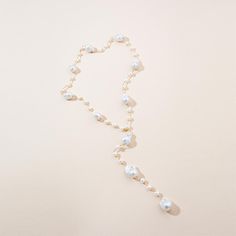 Alluring, luxurious, and utterly romantic. Where legendary style meets expert artistry and craftsmanship. Every collection has its crown jewel, and the Adjustable 18K Gold Baroque Pearl Necklace is ours. Eternally sophisticated, giving the everyday elegant woman a unique, radiant and versatile treasure to pair with her distinctive style. Style it up or Style it down. This gorgeous Adjustable 18K Gold Baroque Pearl Necklace is the queen of versatility. The unique adjustable design allows you to t Elegant Gold Single Strand Pearl Necklace, Evening Baroque Pearl Drop Jewelry, Classic Pearl White Jewelry For Party, Luxury Baroque Pearl Jewelry For Party, Formal Baroque Pearl Necklace With Pearl Charm, Formal Baroque Pearl Necklace With Charm, Baroque Pearl Drop Jewelry For Parties, Luxury Gold Pearl Necklace For Evening, Luxury Jewelry With Baroque Pearl Charm