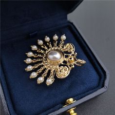 Add some classic sophistication to any outfit with a timeless, beautifully-crafted gold fan, pearl, or classic brooch. Perfect for special occasions like weddings, graduations, and more—or simply to add a touch of elegance day-to-day! Making it a great choice for her, him, or anyone who appreciates the finer things. 👌 M A T E R I A L • Gold plated over brass• Resin Pearls• This product is hypoallergenic (nickel free) and tarnish resistant📏 S I Z E• Length: 4.3 cm (1.69 inch)• Width: 4.3 cm (1. Elegant Pearl Brooches For Formal Occasions, Luxury Gold Pins For Anniversary, Luxury Gold Lapel Pin For Wedding, Classic Gold Lapel Pin For Wedding, Elegant Gold Brooch Jewelry, Elegant Round Brooch For Anniversary, Pearl White Wedding Brooch Jewelry, Pearl White Wedding Jewelry Brooch, Pearl White Wedding Brooch