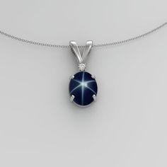 Handmade, this genuine, earth-mined blue star sapphire sterling silver 925 necklace is accented by a diamond. The star sapphire gemstone showcases a 6-ray floating star when exposed to direct sunlight. The gemstones are set in a solid sterling silver oval-shaped pendant setting. Free gift box included with purchase of this trendy, vintage-inspired pendant.Main Gemstone: Blue Star SapphireGemstone Size: 8 x 6 mmGemstone Weight: ~2.3 CaratsGemstone Color: Blue (With Floating Star)Gemstone Origin: Sterling Silver Star Gemstone Jewelry, Star-shaped Gemstone Jewelry For Formal Occasions, Sterling Silver Sapphire Star Jewelry, Celestial Star Sapphire Jewelry, Star Shaped Sapphire Jewelry For Anniversary, Blue Star-shaped Jewelry For Formal Occasions, Formal Blue Star-shaped Jewelry, Star Sapphire Necklace, Star Sapphire Gemstone