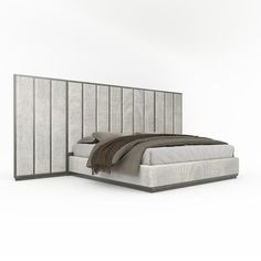 a bed with a headboard made out of fabric and pillows on top of it