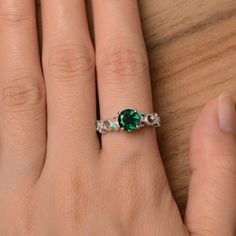 It is lab emerald ring. The main stone is 7 mm*7 mm round cut.weight about 1.68 carats. The basic metal is sterling silver and plated with rhodium. To change the metal to a solid gold (white/rose) or platinum is also available, please ask for a quotation if you want. You can also go to my shop Home for more elegant rings: https://www.etsy.com/shop/godjewelry?ref=hdr_shop_menu Emerald is May birthstone. More emerald rings: https://www.etsy.com/shop/godjewelry?ref=seller-platform-mcnav&section Wedding Ring Round, Milgrain Wedding Ring, Elegant Rings, Swiss Blue Topaz Ring, May Birthstone Rings, Emerald Rings, Wedding Rings Round, London Blue Topaz Ring, Princess Cut Rings