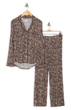 A soft jersey knit pajama set with a pretty print delivers feminine style and essential comfort. 2-piece set Shirt: 25" length (size S); Pants: 9.5" rise, 32" inseam (size S) Shirt: notch lapel, long sleeves, front button closures, chest patch pocket, allover print, contrast piping, knit construction Pants: elasticized waist, pull-on style, allover print, knit construction 95% rayon, 5% spandex Machine wash cold Imported Model’s stats for sizing: 5’11” height, 32” bust, 24” waist, 34” hips. Mode Printed Sets With Relaxed Fit For Lounging, Long Sleeve Sleepwear Matching Set For Lounging, Long Sleeve Matching Set Sleepwear For Lounging, Comfortable Lounge Sets For Fall, Comfortable Lounging Sets For Fall, Comfortable Sets For Lounging In Fall, Casual Printed Long Sleeve Sleepwear, Long Sleeve Lounging Sets For Fall, Casual Long Sleeve Printed Sleepwear