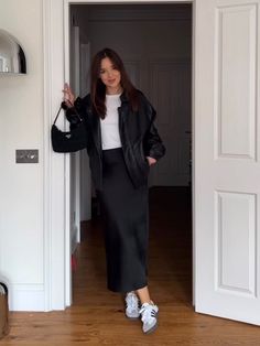 Chill But Classy Outfits, Black Satin Skirt Winter, Silk Midi Skirt Outfit Fall, Long Black Skirt Outfits For Winter, Black Silk Skirt Outfit Fall, Adidas Samba Dress Outfit, Satin Skirt Black Outfit, Sambas Adidas Women Outfit Skirt, Black Long Skirt Outfit Ideas