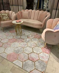 a living room filled with lots of furniture and rugs on top of a floor