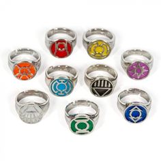 seven rings with different colors and symbols on them