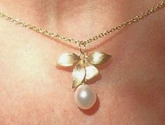 This is a lovely goldfilled necklace with a goldplated orchid, from which a tear drop freshwater pearl is dangling down. This necklace  is an elegant, feminine and romantic gift for women, for weddings and Christmas, balls, and special moments.  Matching earrings: https://www.etsy.com/listing/150809649/sterling-silver-pearl-earrings-pearl?ref=shop_home_active_2 Flower-shaped Pearl Drop Jewelry For Anniversary, Feminine Flower-shaped Pearl Drop Jewelry, Rose Gold Flower-shaped Jewelry With Pearl Drop, Formal Flower-shaped Pearl Pendant Jewelry, Elegant Flower-shaped Pearl Pendant Necklace, Beautiful Terrariums, Terrarium Jewelry, Silver Pearl Earrings, Elegant Feminine