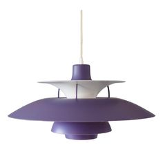 a purple and white lamp hanging from a ceiling