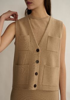 Inspired by vintage safari vest jacket, this knit vest in milano stitch has a v-neckline, buttoned placket, and front patch pockets.  55% extra-fine merino wool, 45% cotton Luxury Wool Vest, Luxury Merino Wool Vest For Fall, Wool Vest Jacket, Alpaca Wool Vest, Safari Vest, Vintage Safari, Cotton Vest, Cardigan Vest, Cashmere Wool