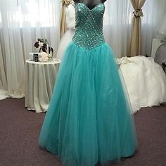 Turquoise Tulle Jeweled Bodice With Laced Up Back With Glitter Tulle Bolaro. Measurements B37 W30 H40 Because Of Lace Back Can Go Up Or Down Size Floor-length Light Blue Gown For Quinceanera, Green Floor-length Dress For Quinceanera, Floor-length Turquoise Gown For Party, Turquoise Floor-length Gown For Party, Turquoise Fitted Prom Evening Dress, Turquoise Fitted Evening Dress For Prom, Turquoise Fitted Prom Dress, Fitted Turquoise Evening Dress For Prom, Turquoise Fitted Evening Dress For Wedding