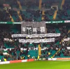 a large banner in the middle of a soccer field that reads end the campaign of football fans