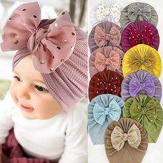 a baby girl wearing a headband with many different bows on it's head