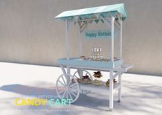 an ice cream cart with cupcakes on it