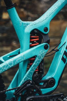 the front end of a blue mountain bike